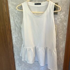 Super soft white asymmetrical peplum top